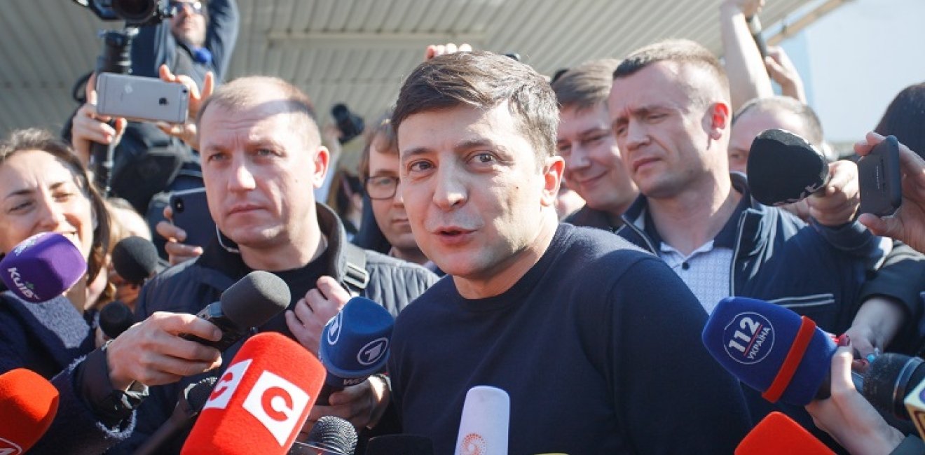 Presidential candidate Volodymyr Zelensky near the polling station he voted at, answering questions from journalists.