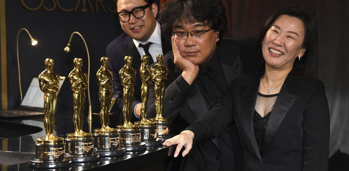 Han Jin Won, from left, Bong Joon-ho, and Kwak Sin Ae at the Oscars