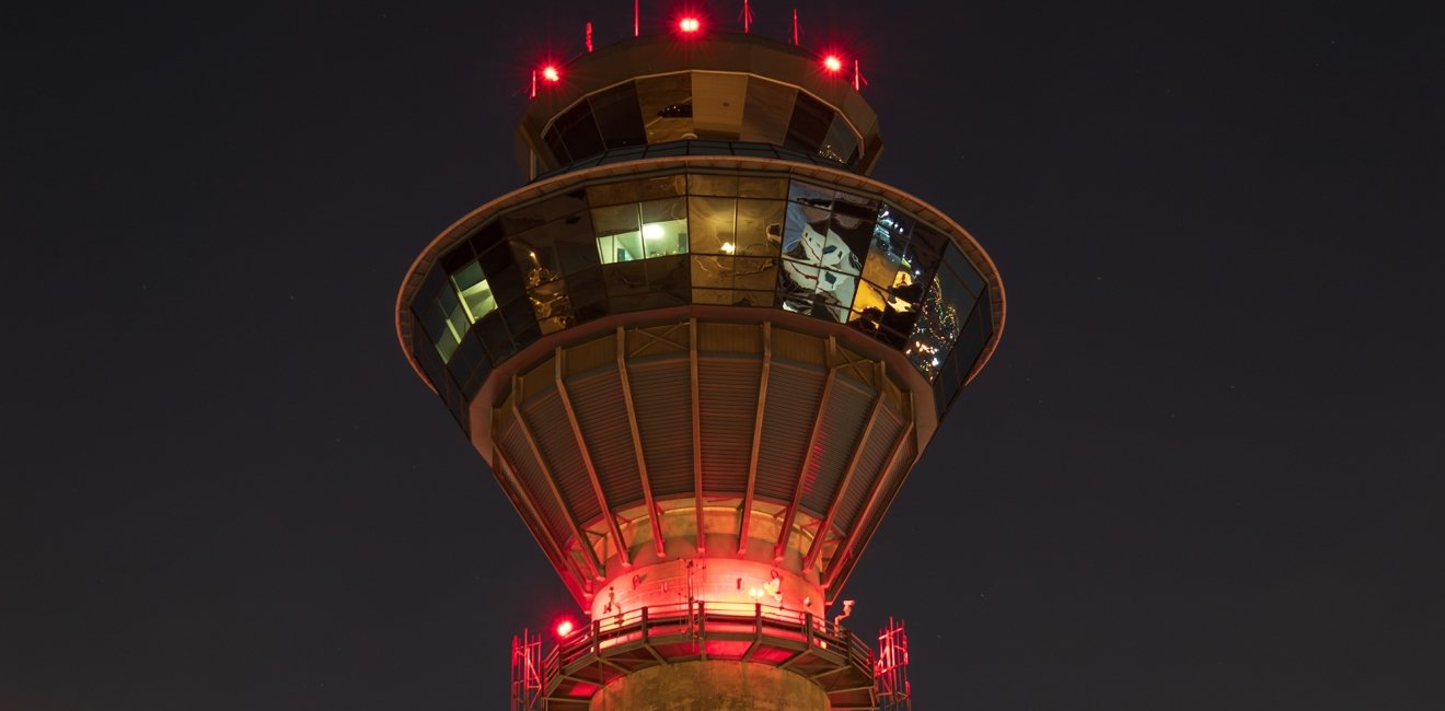 NavCanada Control Tower at Toronto Pearson International Airport (YYZ) as seen in the evening sky on a clear night.