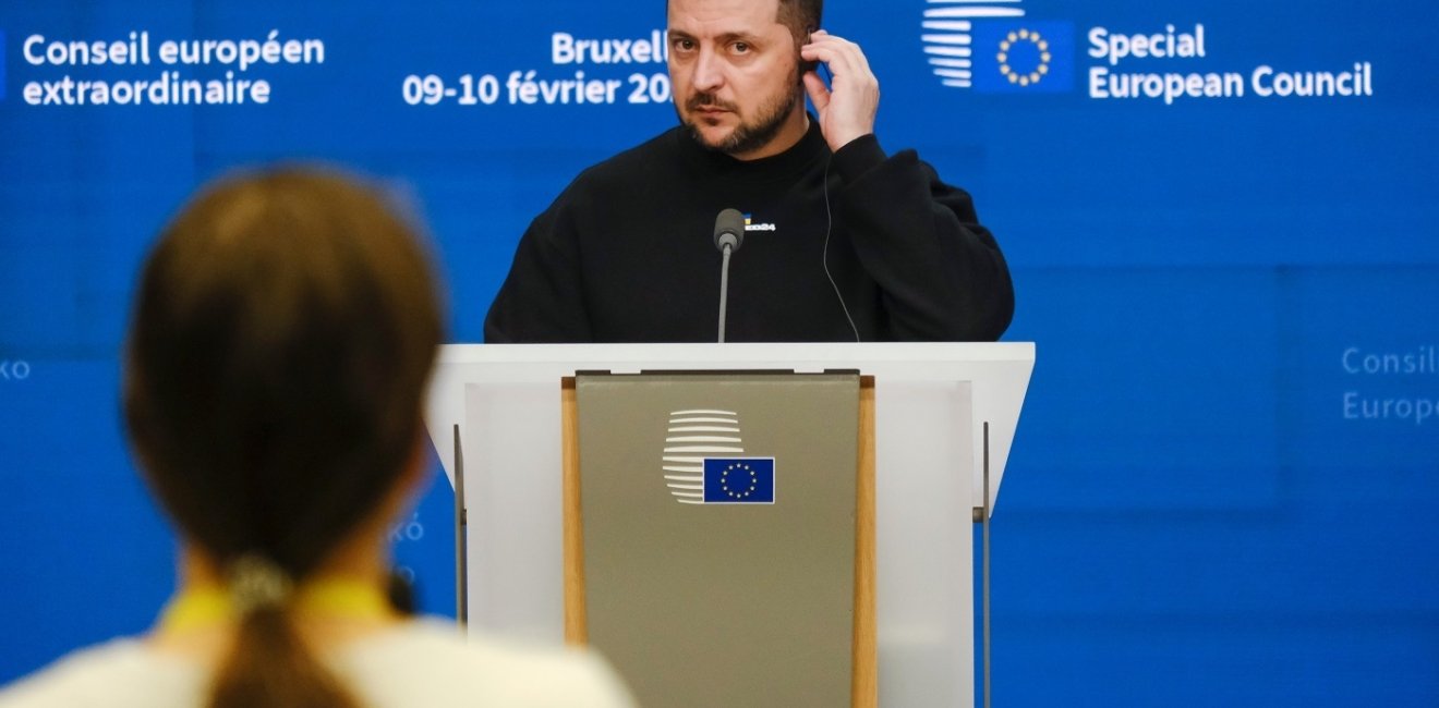 Zelenskyy on a podium at an event 