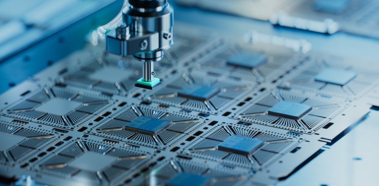 Close-up of Silicon Die are being Extracted from Semiconductor Wafer and Attached to Substrate by Pick and Place Machine.