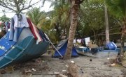 Migrants camp in Necoclí before crossing the Darién Gap