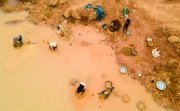 Kunsu, Ghana, March 20, 2023: Rural Women in Small Scale Mining (Galamsey) in Ghana, Africa. The quest for the daily meal of these women relies on them finding gold in an already mined land.