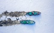 Two icebreakers breaking ice on Vistula river, Poland, 2020-02-18, aerial view