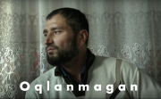 still from film Oqlanmagan with title overlaid