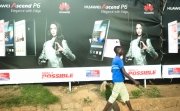 Kampala Uganda on January 23, 2018: people walking past mobile phone advertisement