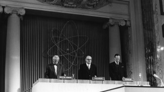 Mr Sterling Cole (left), Director General of the International Atomic Energy Agecny, Austrian Chancellor Dr. Julius Raab (center) and Dr. Paul R. Jolles, Deputy Director General for Administration, Liaison and Secretariat pause for a minute of silence at the opening session of the second Annual General conference of the IAEA. Delegates from more than 60 countries are attending the meeting. (Hofburg, former Imperial Palace, Vienna, Austria, 22 September 1958)