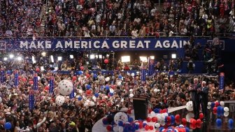 Republican U.S. presidential nominee Donald Trump stands with vice presidential nominee Mike Pence as balloons descend after his speech at the Republican National Convention in Cleveland, Ohio, U.S., July 21 2016. REUTERS/Carlo Allegri