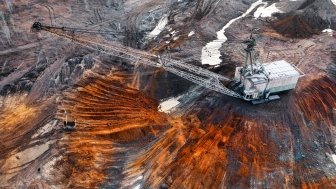 An excavator in a quarry extracting rare minerals.