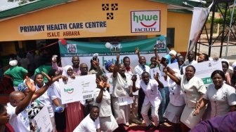 Health workers celebrating the launch of the Basic Health Care Provision Fund (known as ‘huwe’) in Nigeria.