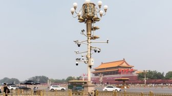 A lamp post with surveillance cameras in Beijing, China.