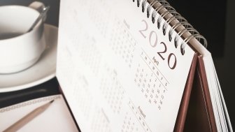 A close up of a desk calendar with the year 2020 visible