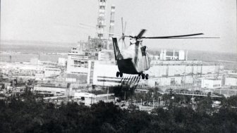 Helicopter spraying decontamination liquid over Chernobyl.