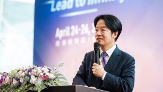 Vice President Lai Ching-te speaking at a podium at an event.