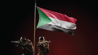 Concept of military conflict with soldier statues and waving national flag of Sudan