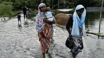 Women walking in flood