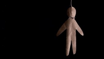 Paper doll hanging by a noose 