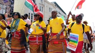 Colourful African campaigners for LGBTI liberation to be recognized with their country’s liberation in West Street during Brighton Pride Parade 2018 in Brighton, East Sussex/UK