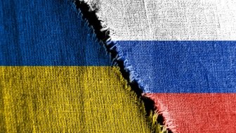 Russia Ukraine flag with tear