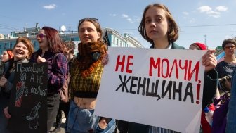 Participants at a women's march with the poster "Do not be silence, woman!" - St. Petersburg, 2019