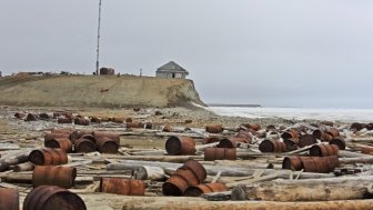 Rusty fuel and chemical drums in the Arctic.