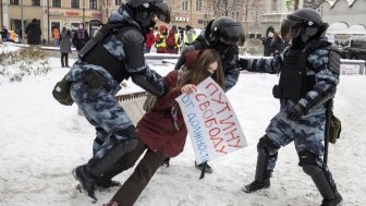 Police tackling a protester 