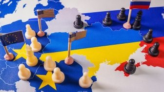 EU, USA and Russian flags with chess pieces symbolizing the conflict and control of Ukraine