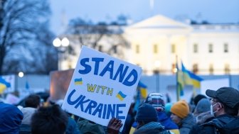 Washington DC, USA- February 24th, 2022: Anti-war Protesters holding pro-Ukraine signs outside the White House after Russia invaded Ukraine.