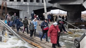 IRPIN, UKRAINE - Mar. 09, 2022: War in Ukraine. Thousands of residents of Irpin have to abandon their homes and evacuate as russian troops are bombing a peaceful city. War refugees in Ukraine