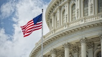 Washington D.C. Capitol dome detail with waving American flag