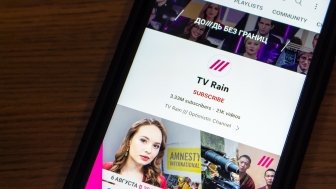 A phone screen depicting the Youtube channel of Russian-language independent television channel TV Rain, also known as Dozhd