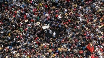 The president of Mexico Andres Manuel Lopez Obrador walking with hundreds of thousands of people towards the zocalo of Mexico City to render his fourth government report.