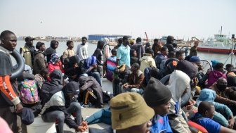 Group of migrants on a boat attempting to cross the Mediterranean