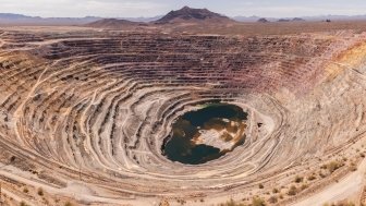 Aerial view of an exhausted open pit copper mine near Ajo, Arizona, USA.