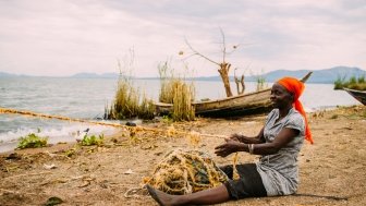 A woman fishing near Lake Victoria