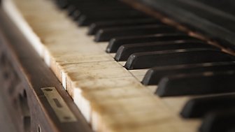 Old piano with faded keys