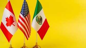 US Mexico and Canada flags on desk