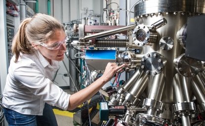 NREL scientist uses a Compound Semiconductor Molecular Beam Epitaxy System