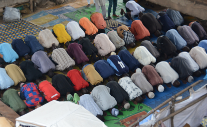 Muslim faithfuls praying under a bridge in Lagos, Nigeria