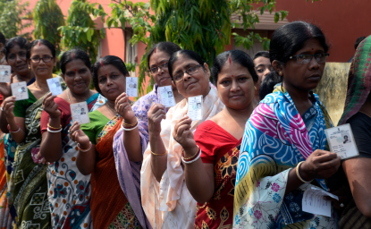 Indian women stand in queue with their Voter ID Card in hand during the West Bengal Three tier Panchayat Election approximate 40 k.m. from state capital Kolkata on May 14, 2018 in Hooghly, India.