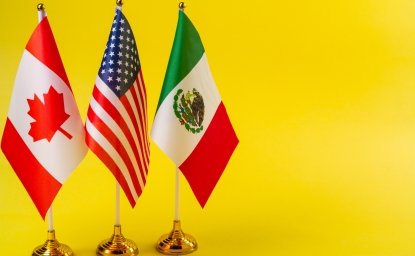 US Mexico and Canada flags on desk