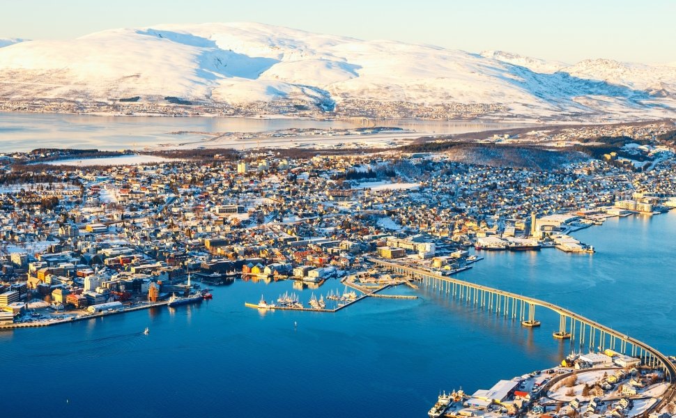 Above view of beautiful winter landscape of snow covered town Tromsoe in Northern Norway