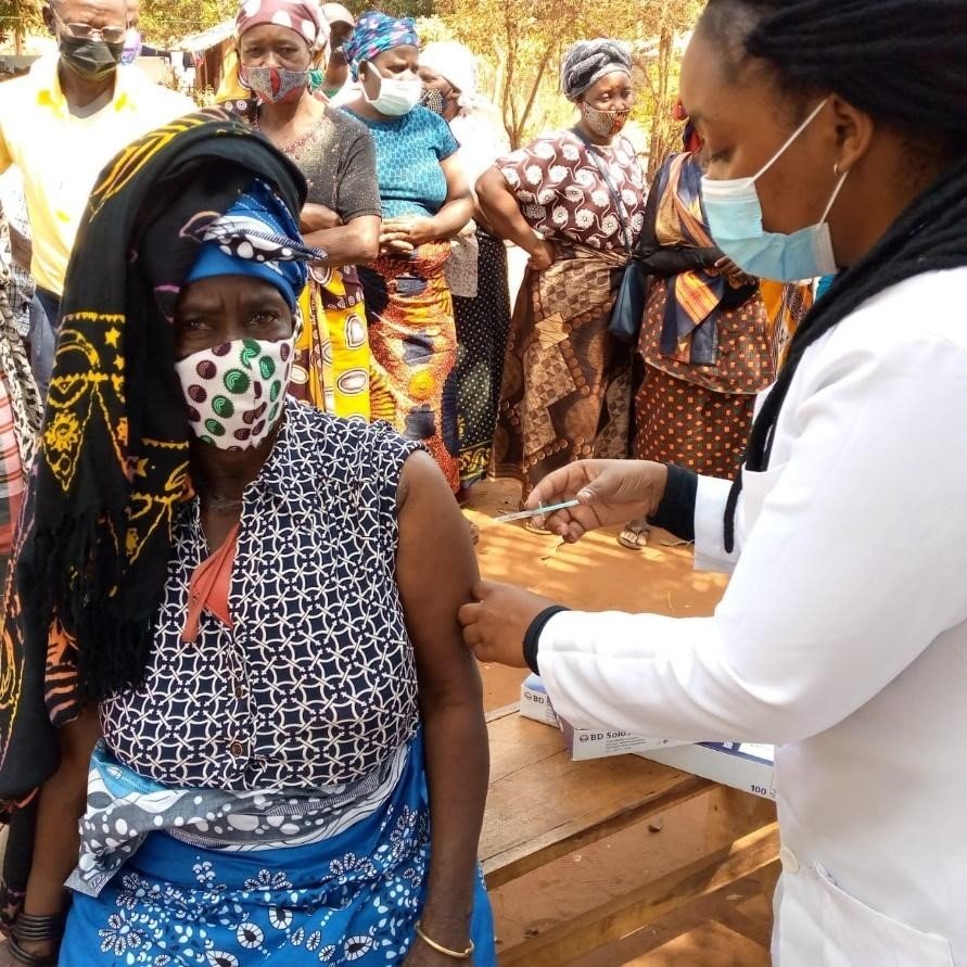 Woman receiving a COVID-19 vaccination at the "Campo dos Macondes" (football camp) in Nampula Province, Mozambique. 