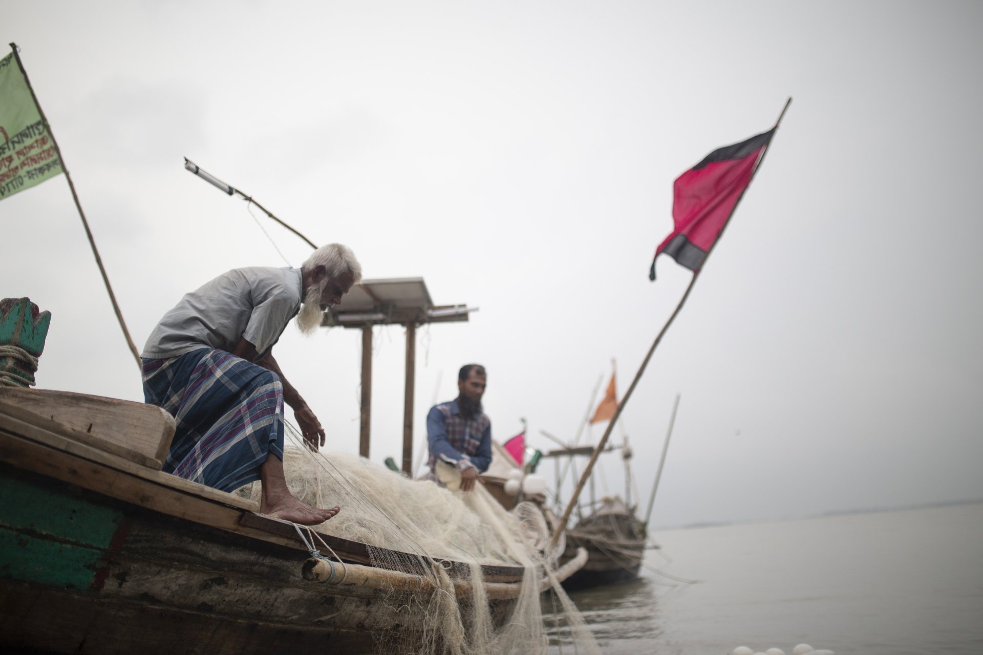 Bangladeshi men beside river