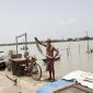 Village ringed with concrete embankments to slow erosion 